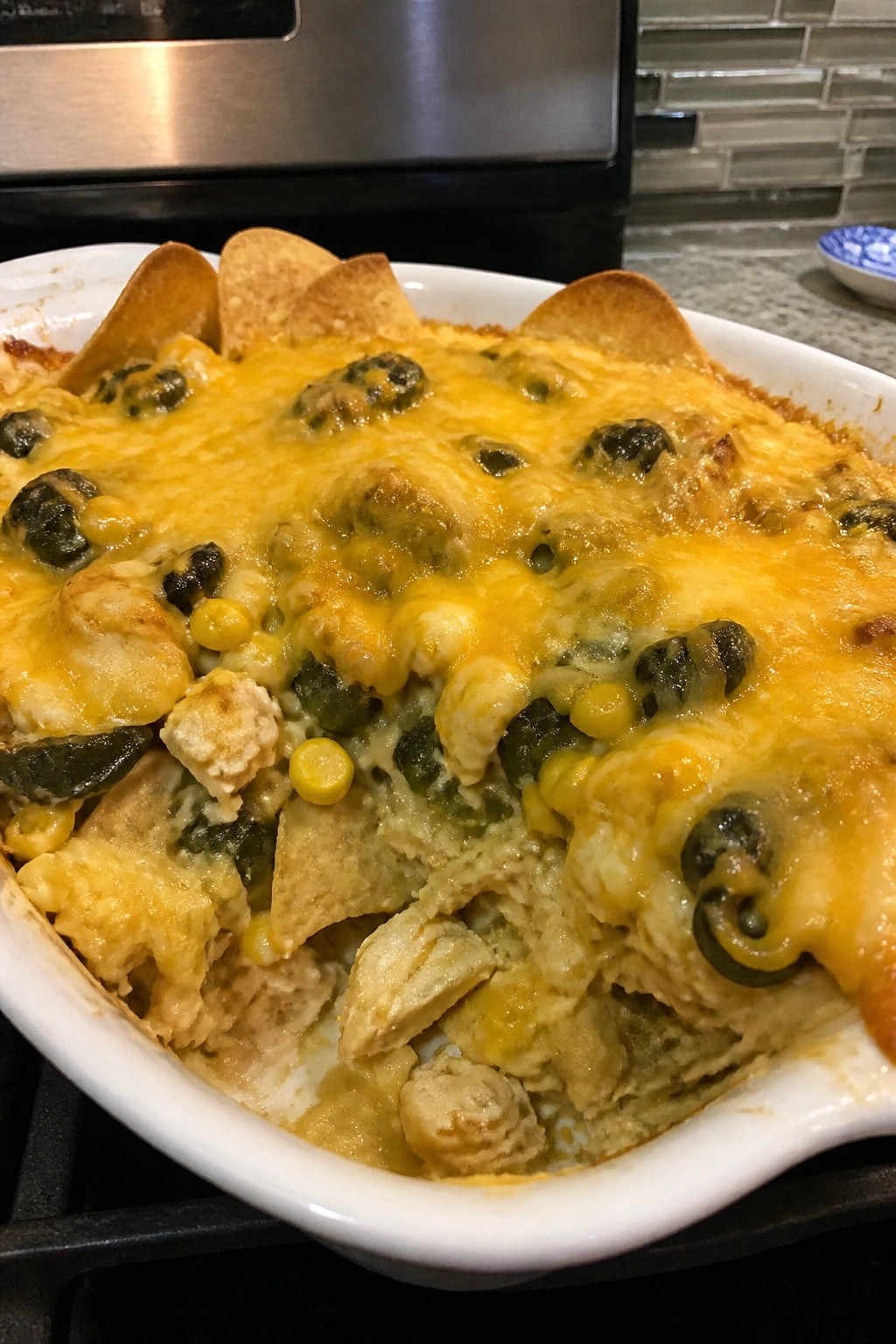 Cheesy Roasted Poblano and Corn Chicken Nacho Casserole