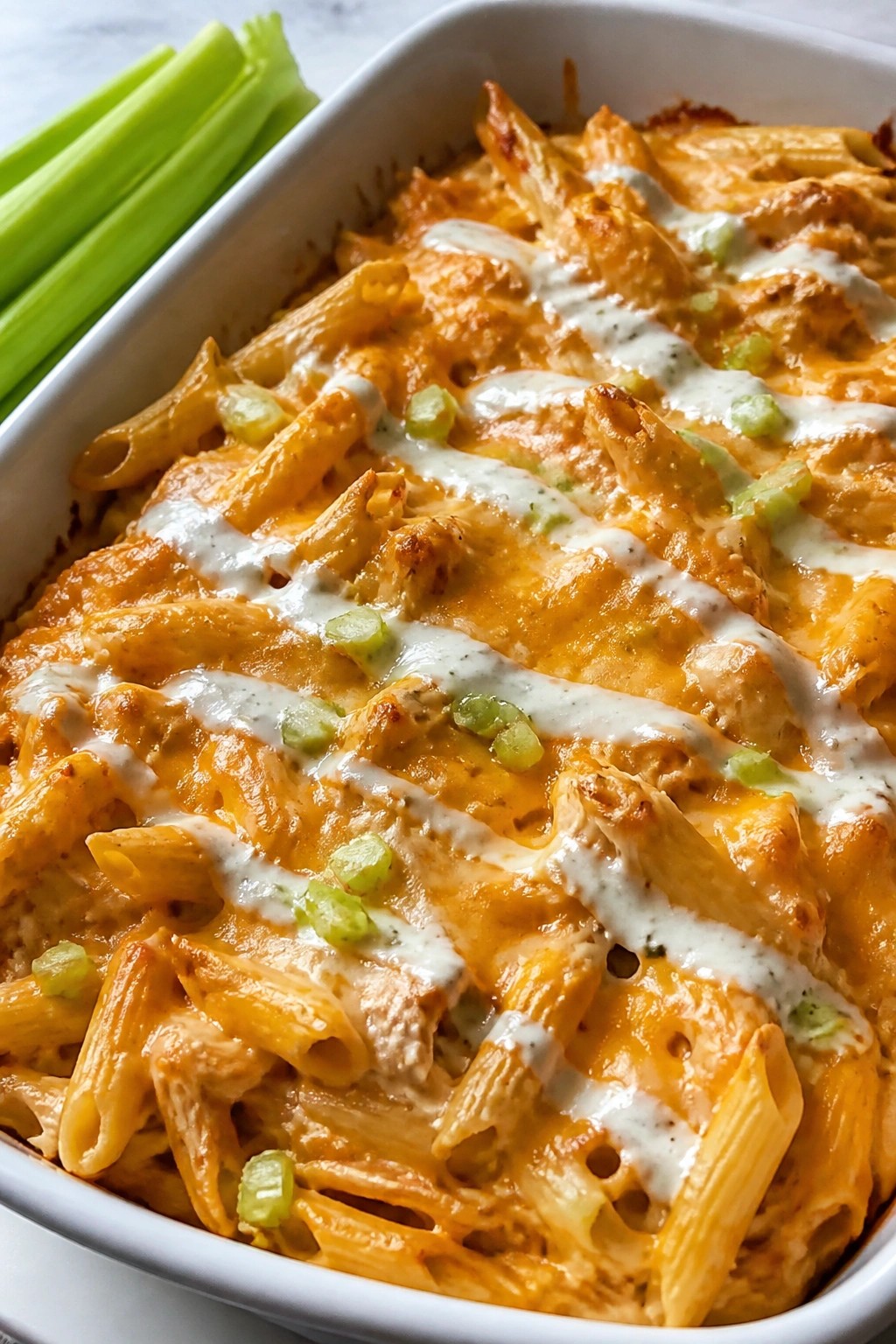 Buffalo Chicken Casserole with Ranch Drizzle and Celery