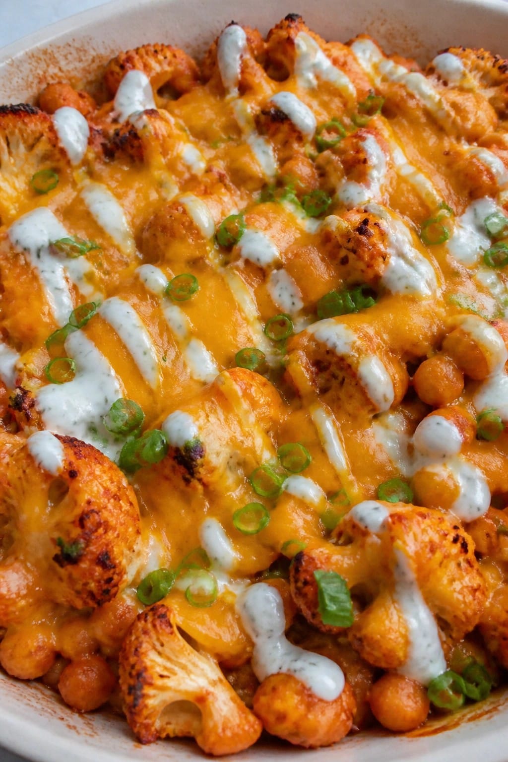 Buffalo Cauliflower Chickpea Casserole with Ranch Drizzle