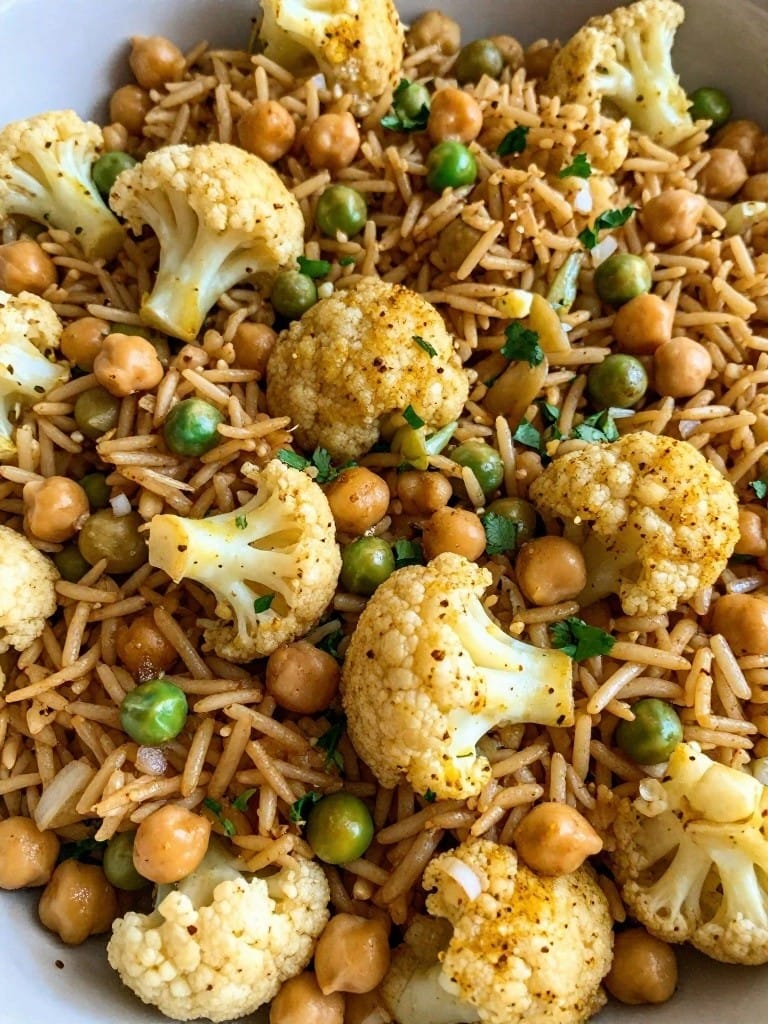 Indian Spiced Cauliflower Pea and Chickpea Rice Bake