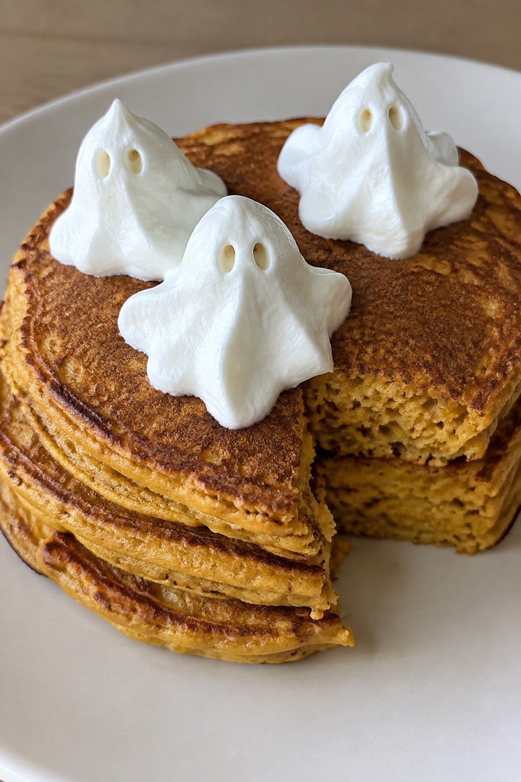 Ghostly Pumpkin Pancakes with Whipped Cream Toppers