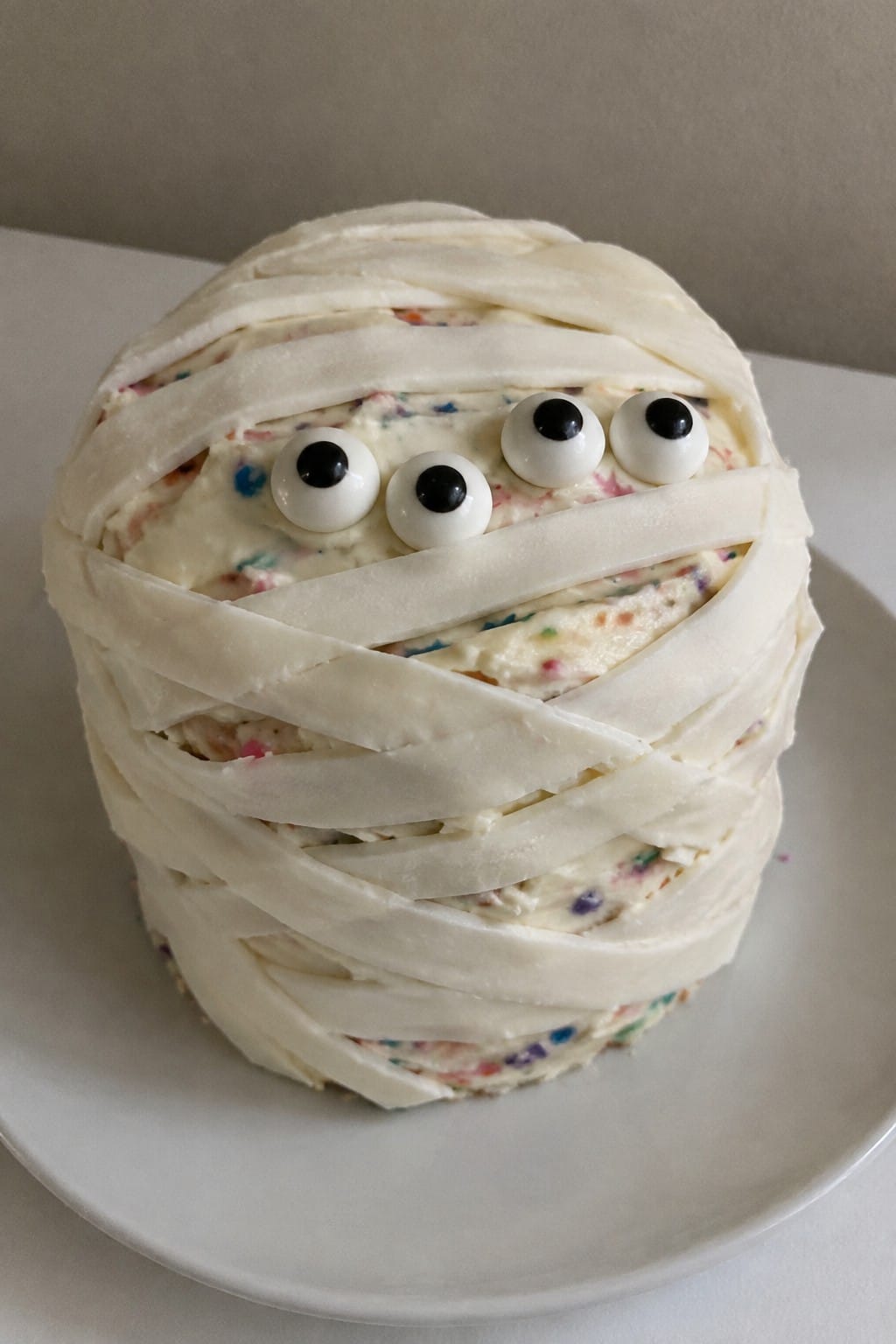 Mummy Wrapped Funfetti Cake with Candy Bandages