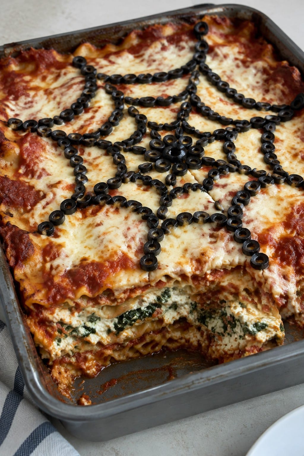 Black Olive Spiderweb Lasagna with Ricotta and Spinach