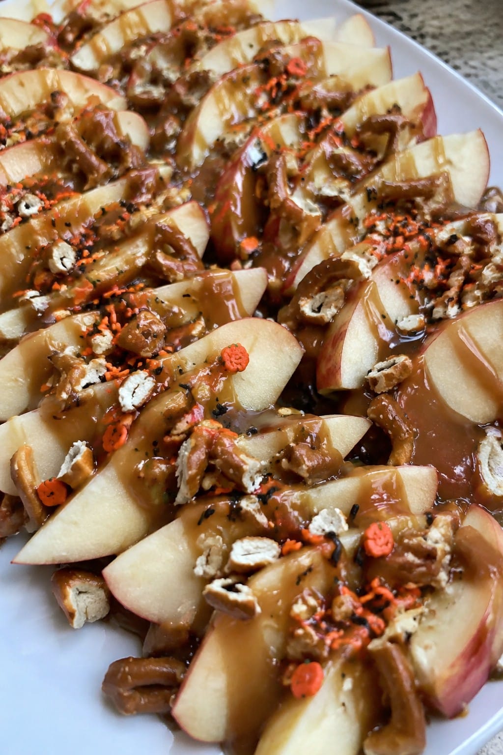 Caramel Apple Nachos with Pretzel Crumbles and Halloween Sprinkles