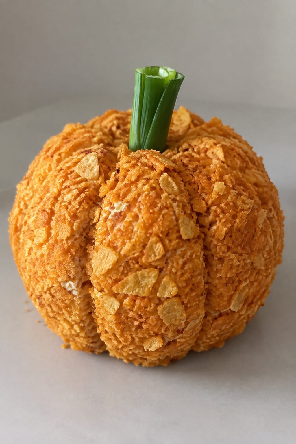 Pumpkin-Shaped Cheese Ball Rolled in Crushed Tortilla Chips