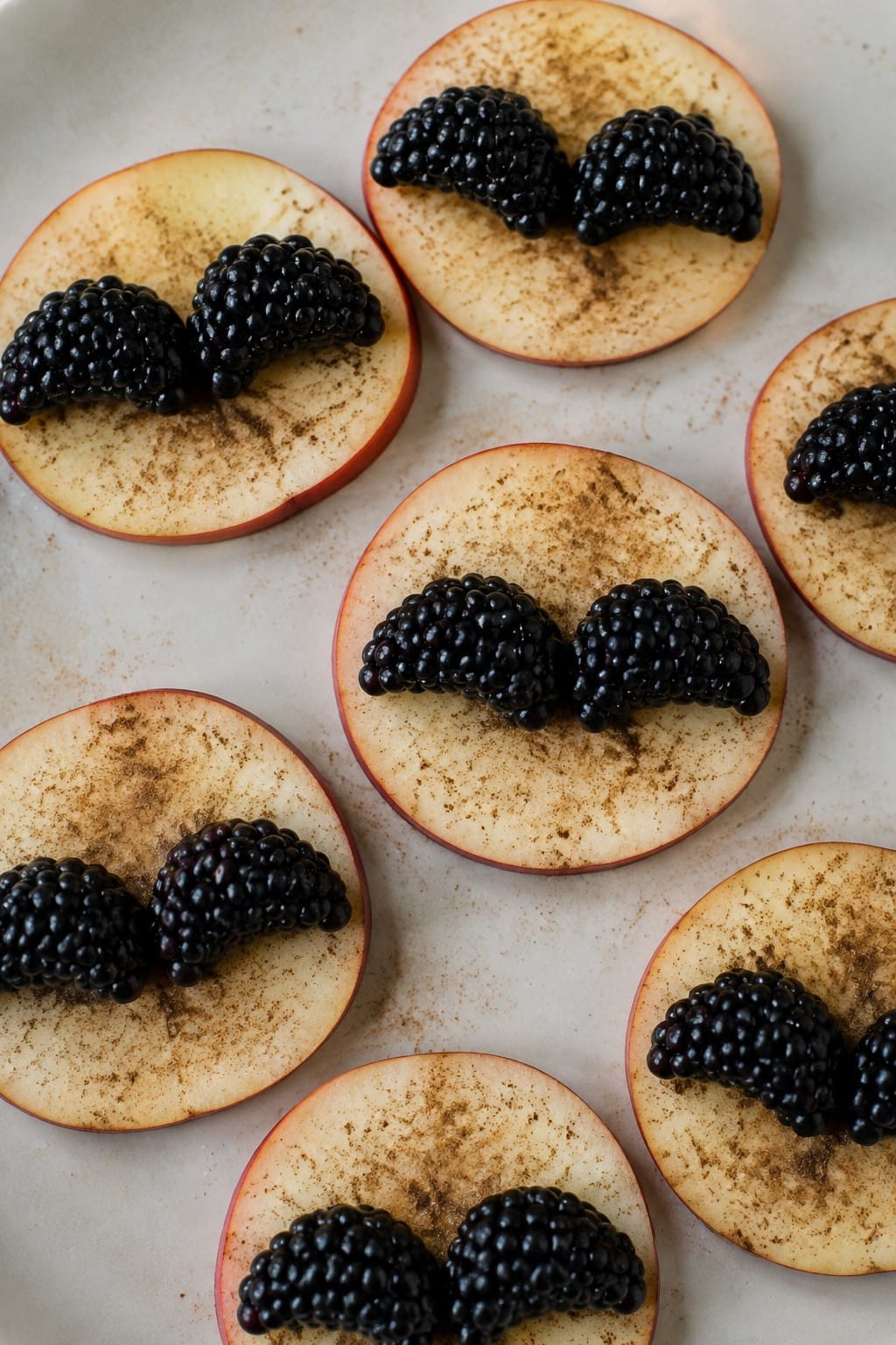 Blackberry Bat Wings on Cinnamon Apple Slices