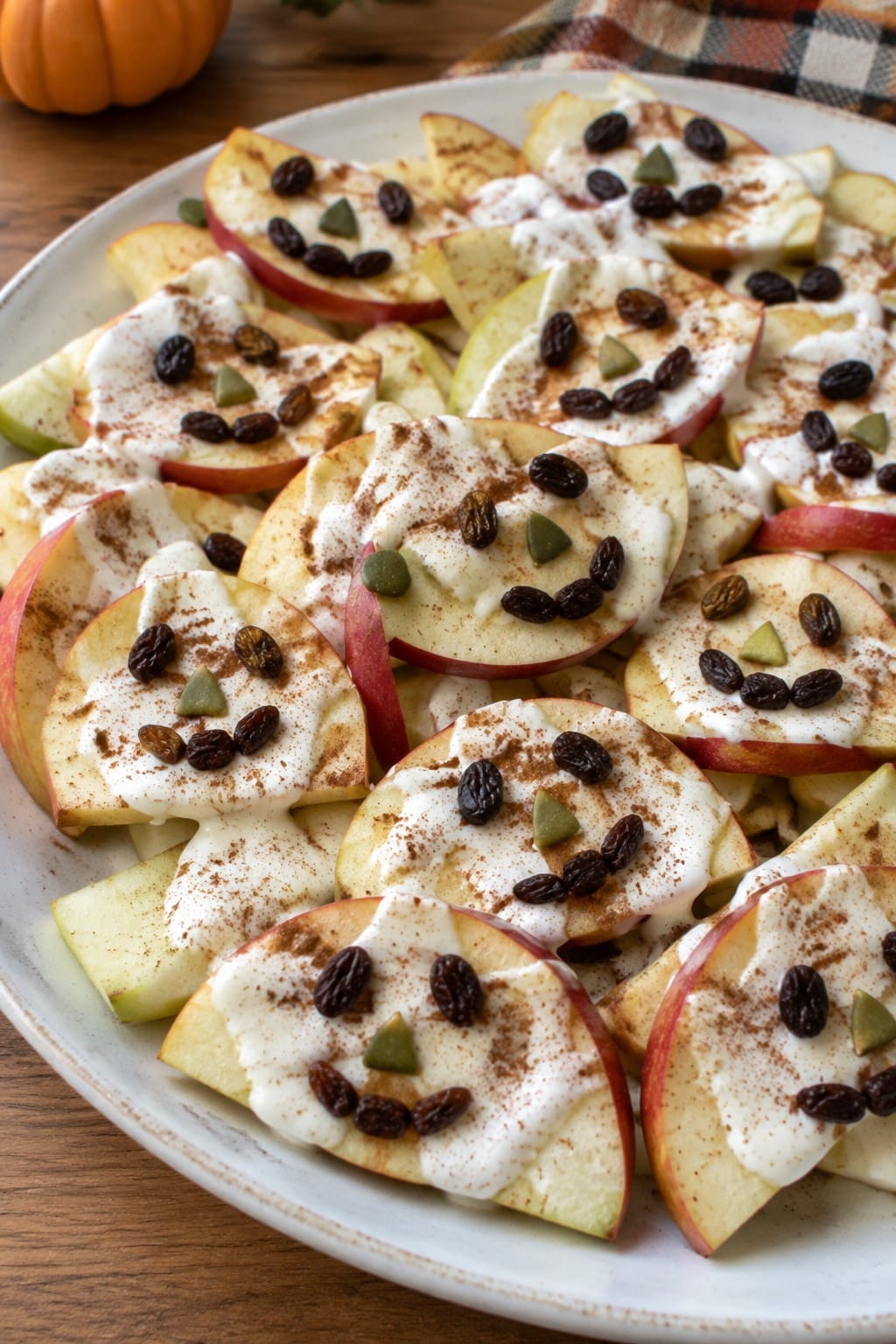 Jack-o'-Lantern Apple Nachos with Greek Yogurt Drizzle