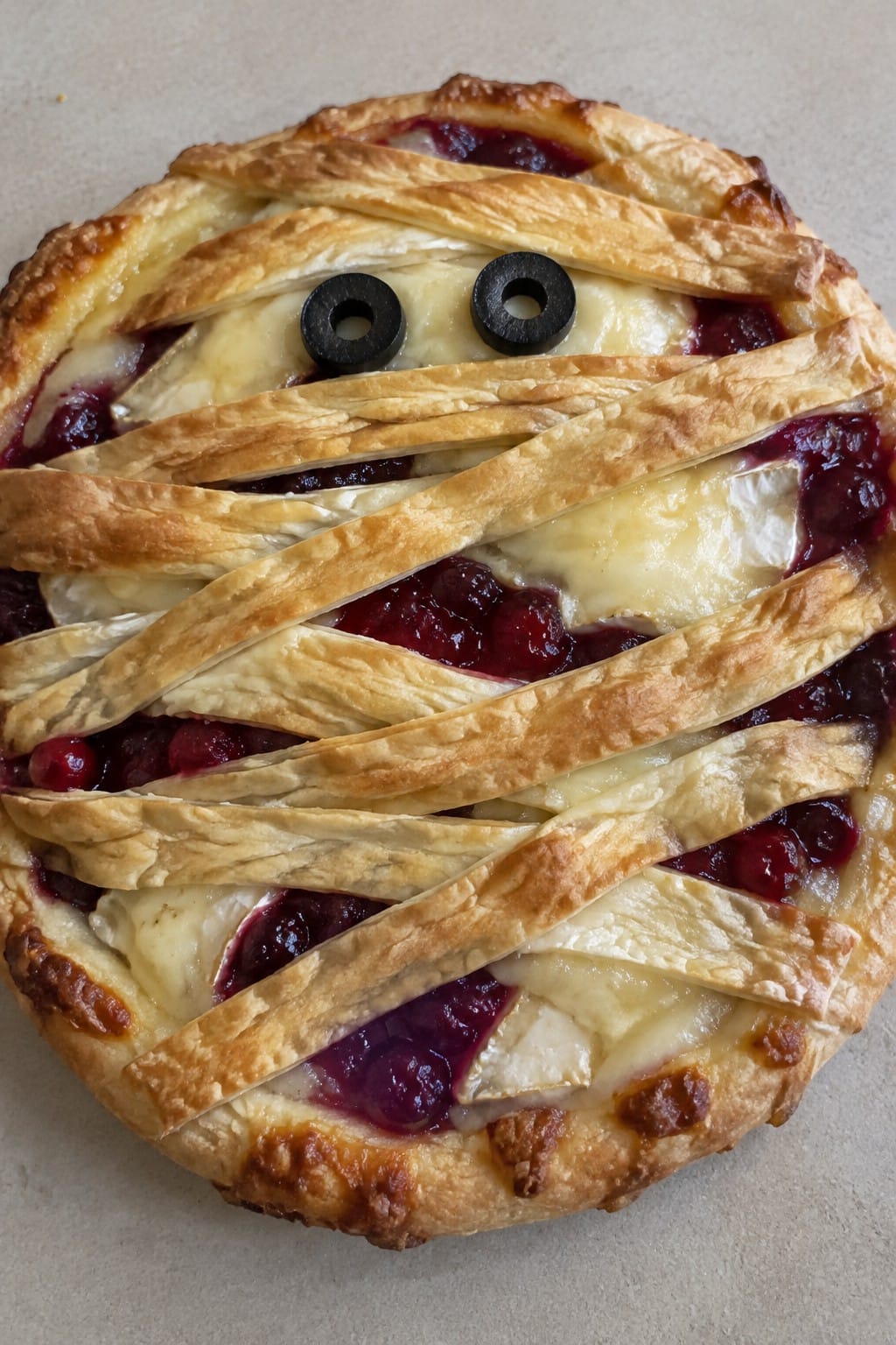 Mummy-Wrapped Brie and Cranberry Pizza