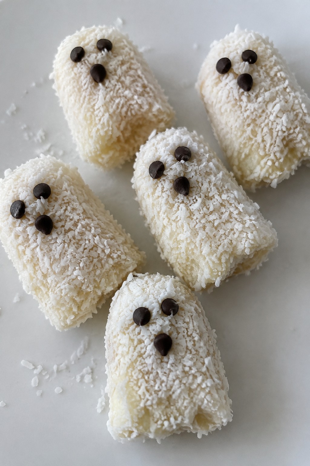 Frozen Banana Ghosts Rolled in Shredded Coconut