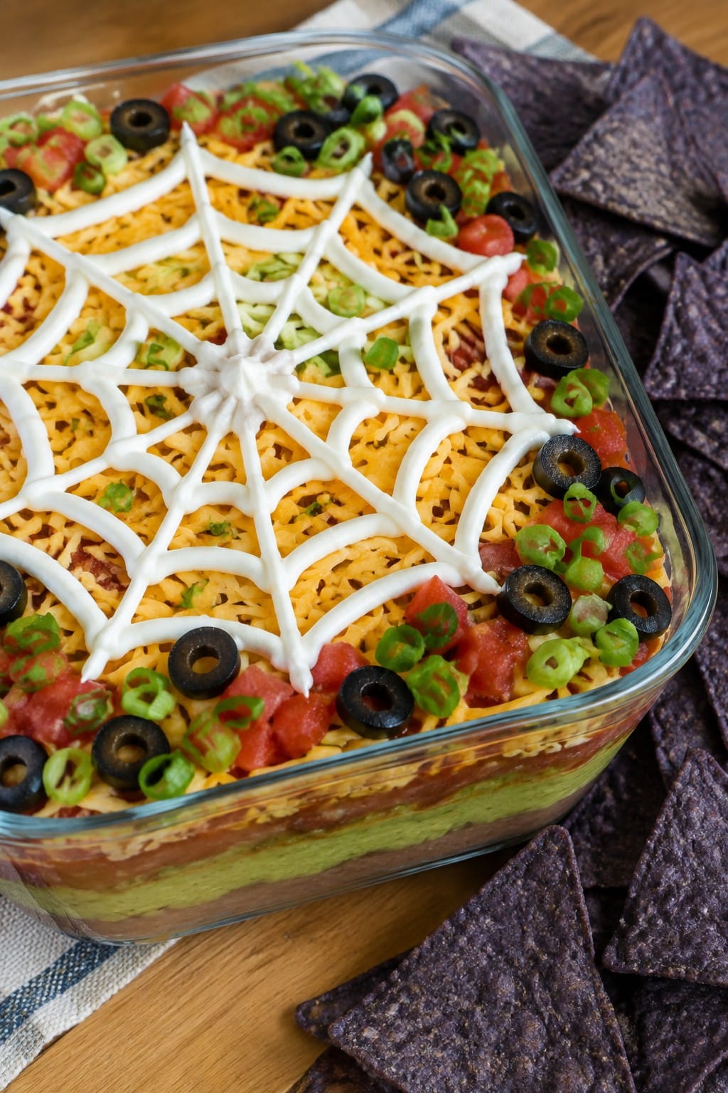 Spiderweb Seven-Layer Taco Dip with Blue Corn Chips