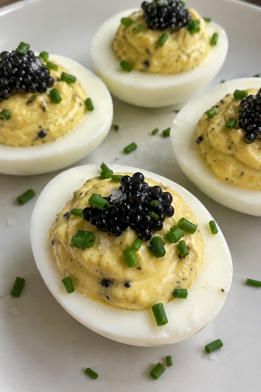 Black Truffle Deviled Eggs with Caviar and Chives