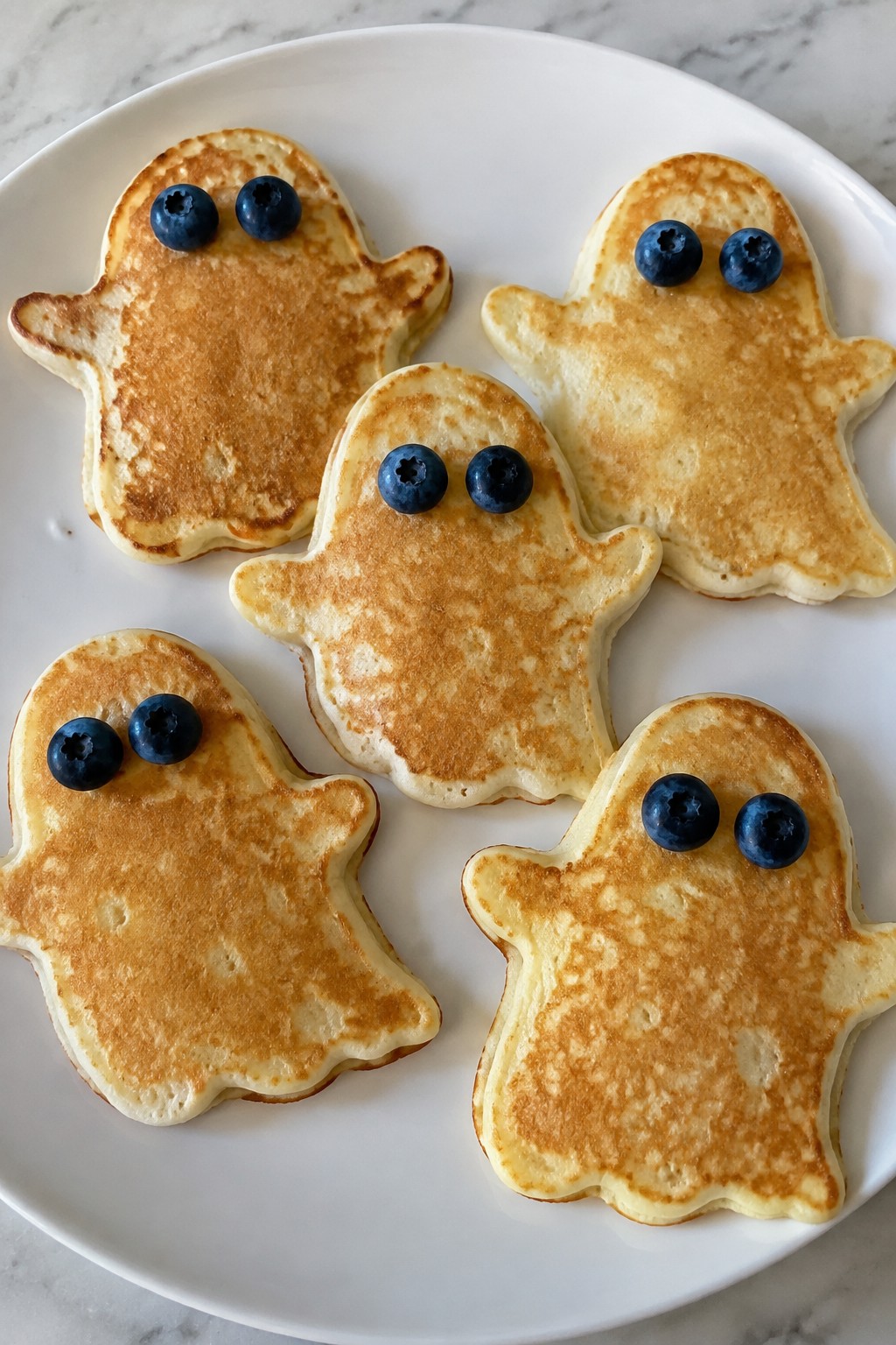 Ghost Pancakes with Blueberry Eyes