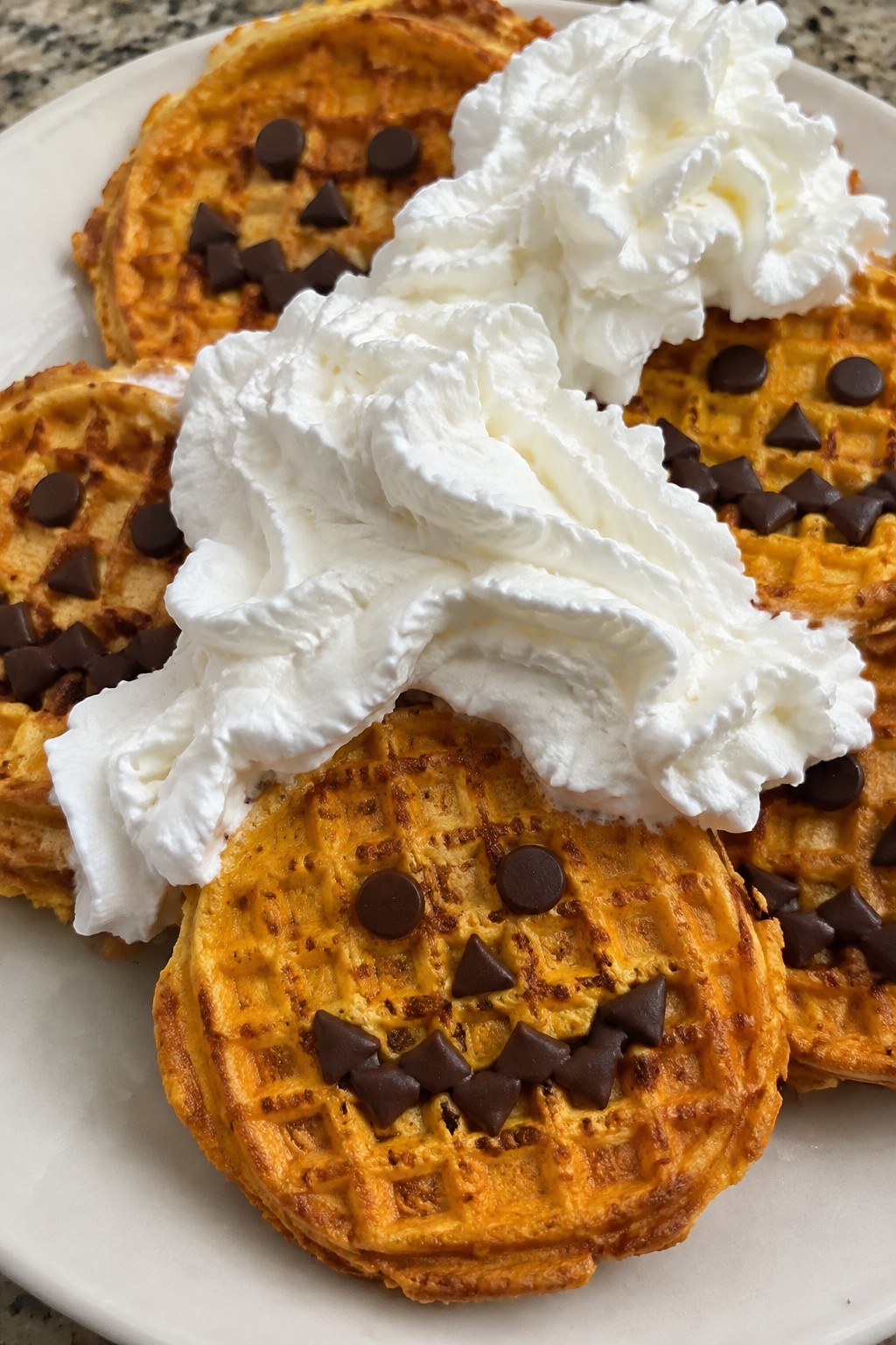 Jack-o'-Lantern Waffles with Whipped Cream