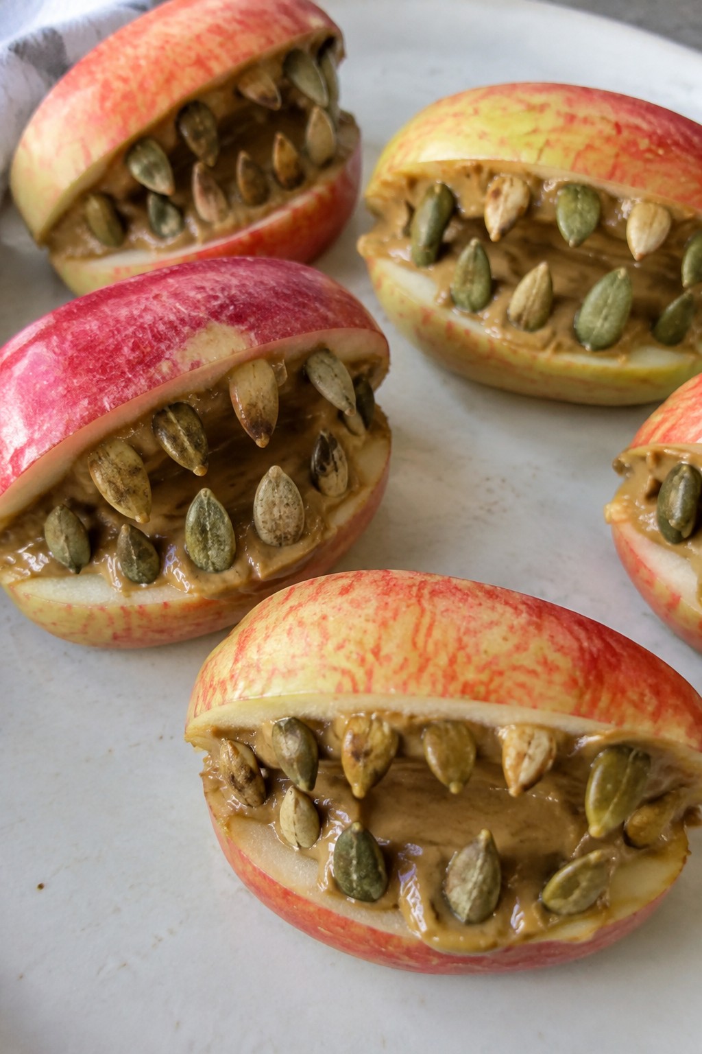 Apple Monster Mouths with Sunflower Seed Butter and Pumpkin Seeds