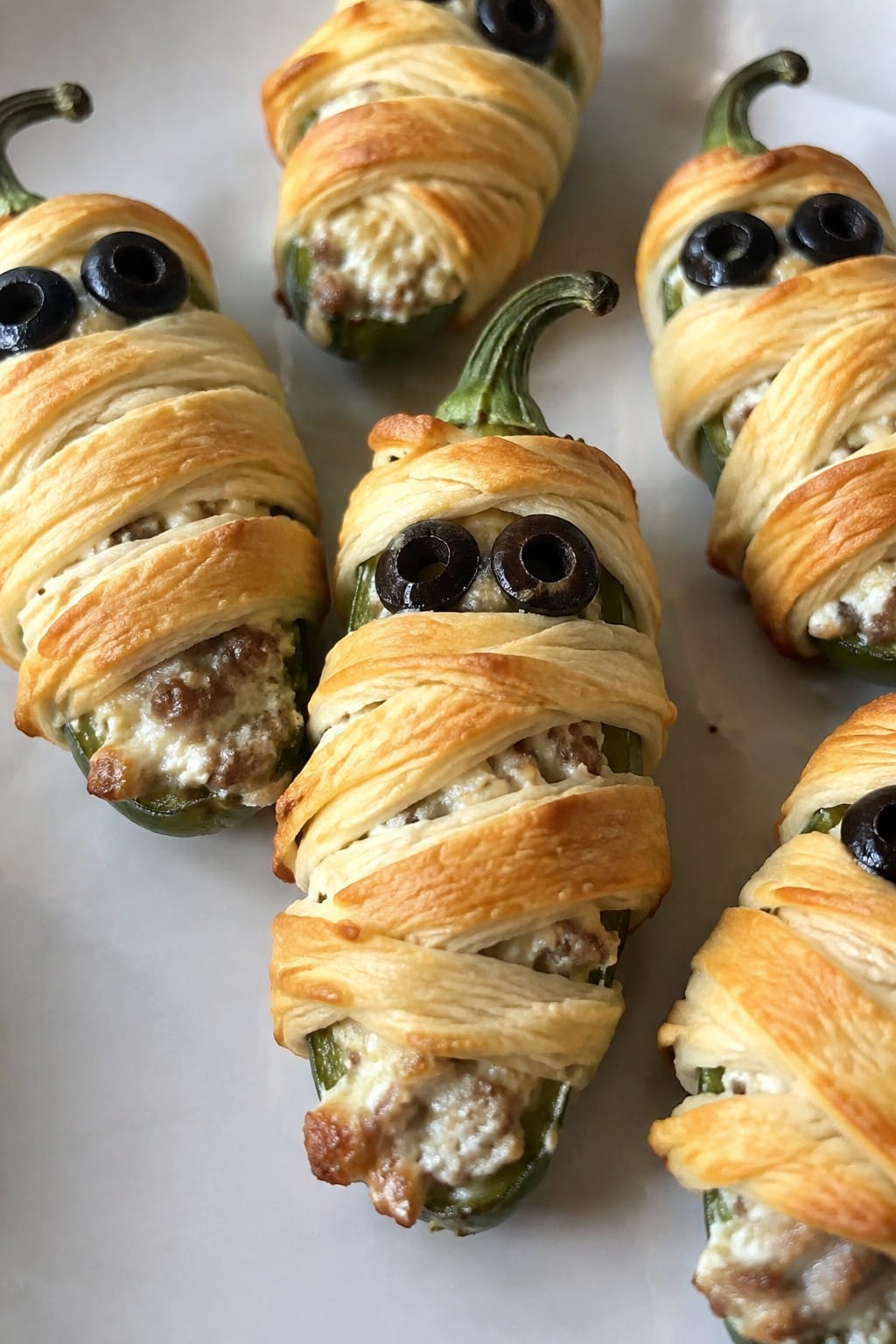 Sausage-Stuffed Jalapeño Mummies Wrapped in Crescent Dough