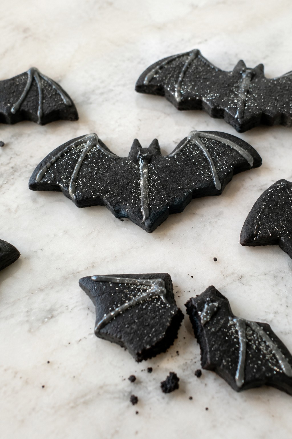 Bat Wing Black Cocoa Cookies with Silver Glitter Icing
