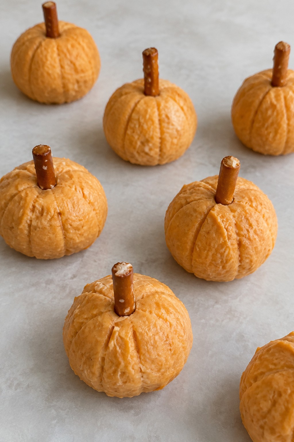 Cream Cheese Pumpkin Bites with Pretzel Stems
