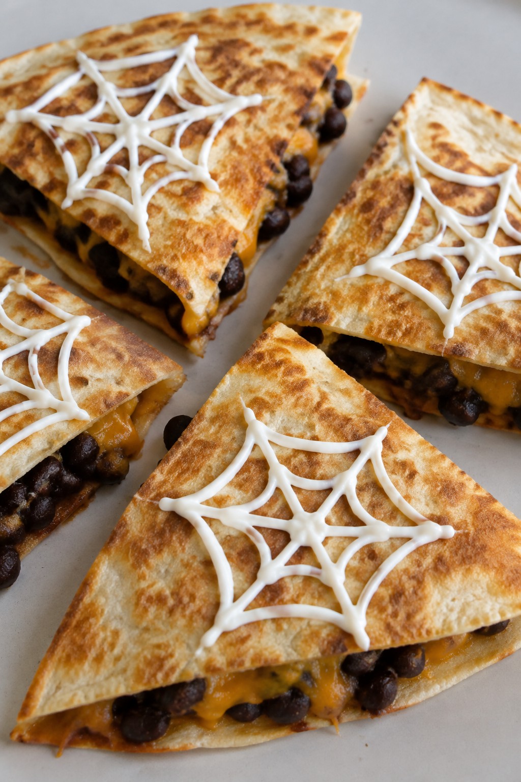 Spiderweb Black Bean Quesadilla Triangles