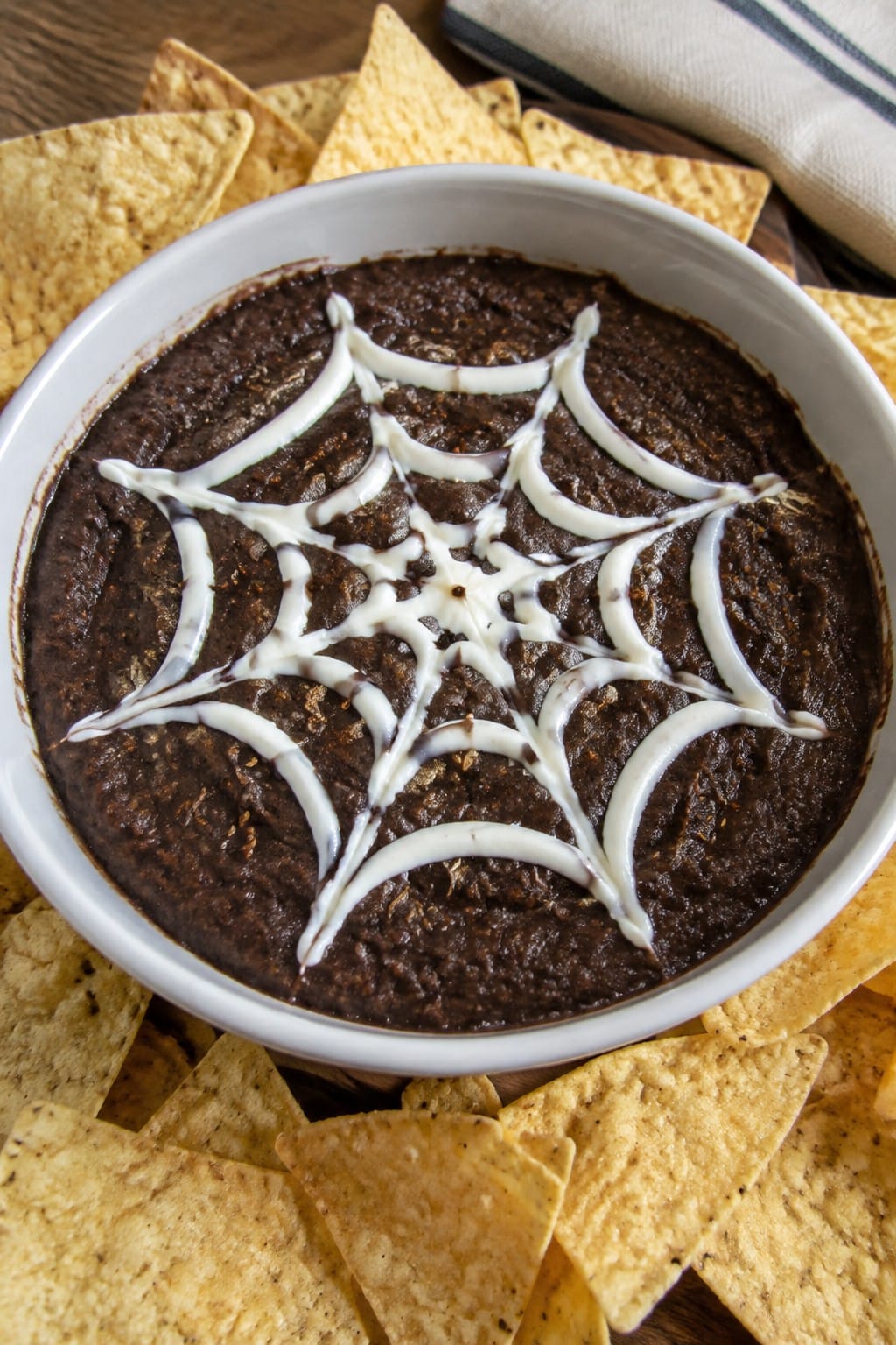 Spiderweb Black Bean Dip with Tortilla Chips