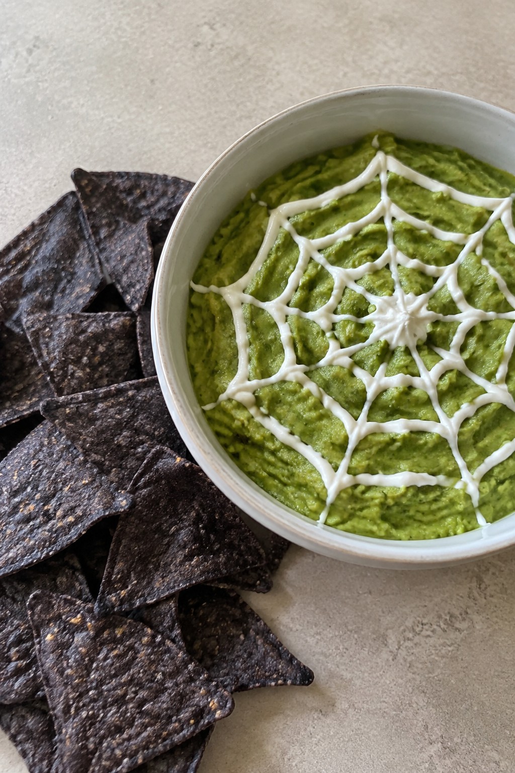 Spiderweb Guacamole with Black Bean Chips