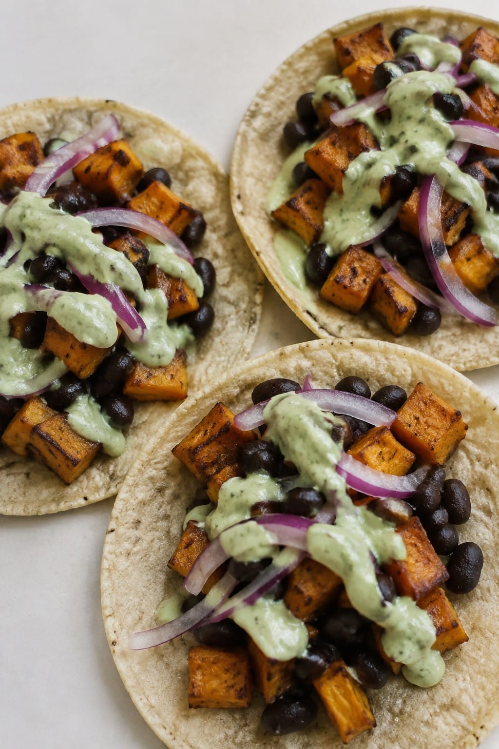 Black Bean and Sweet Potato Tacos with Avocado Crema