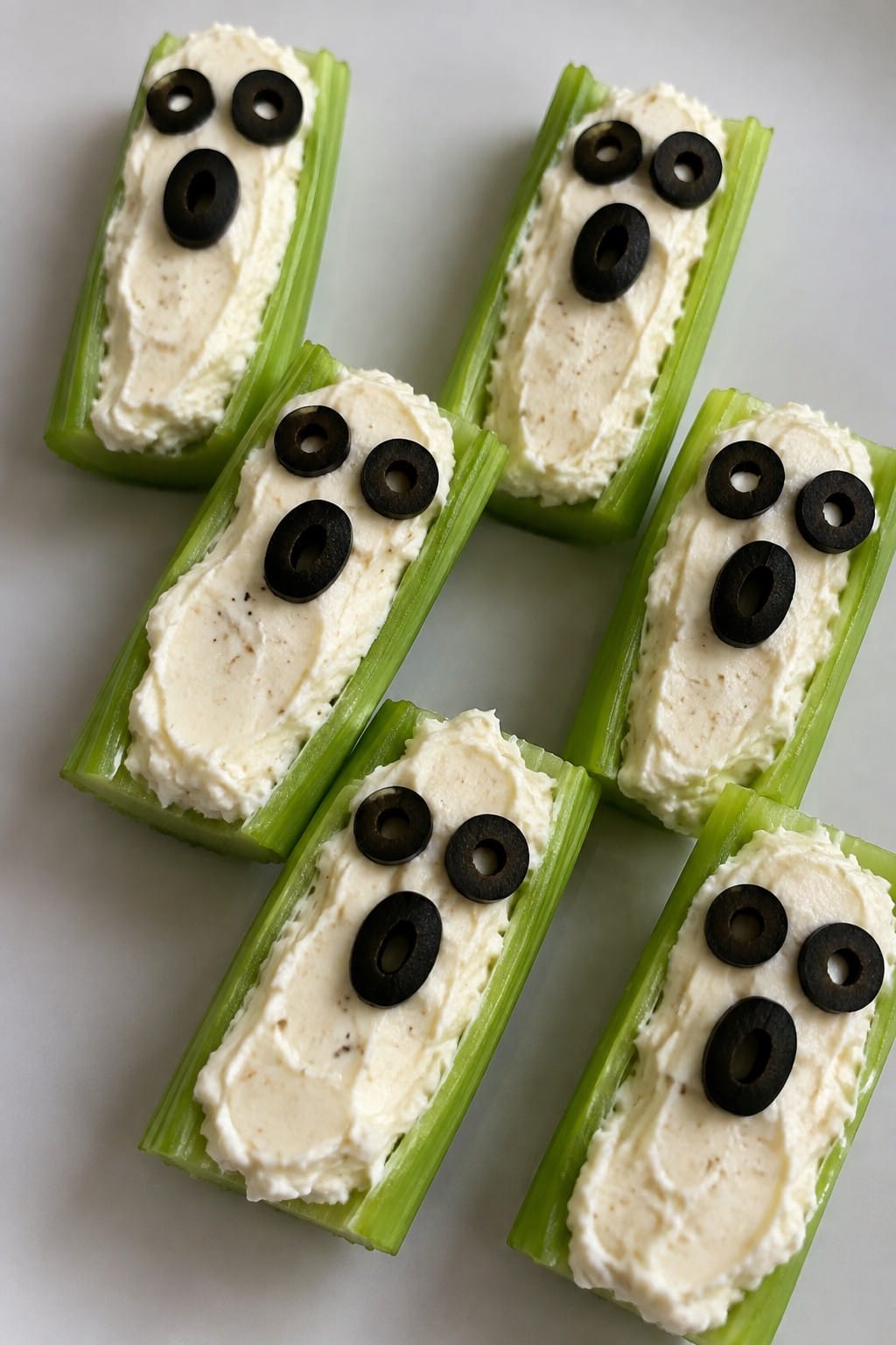 Ghostly Cheese-Stuffed Celery Boats