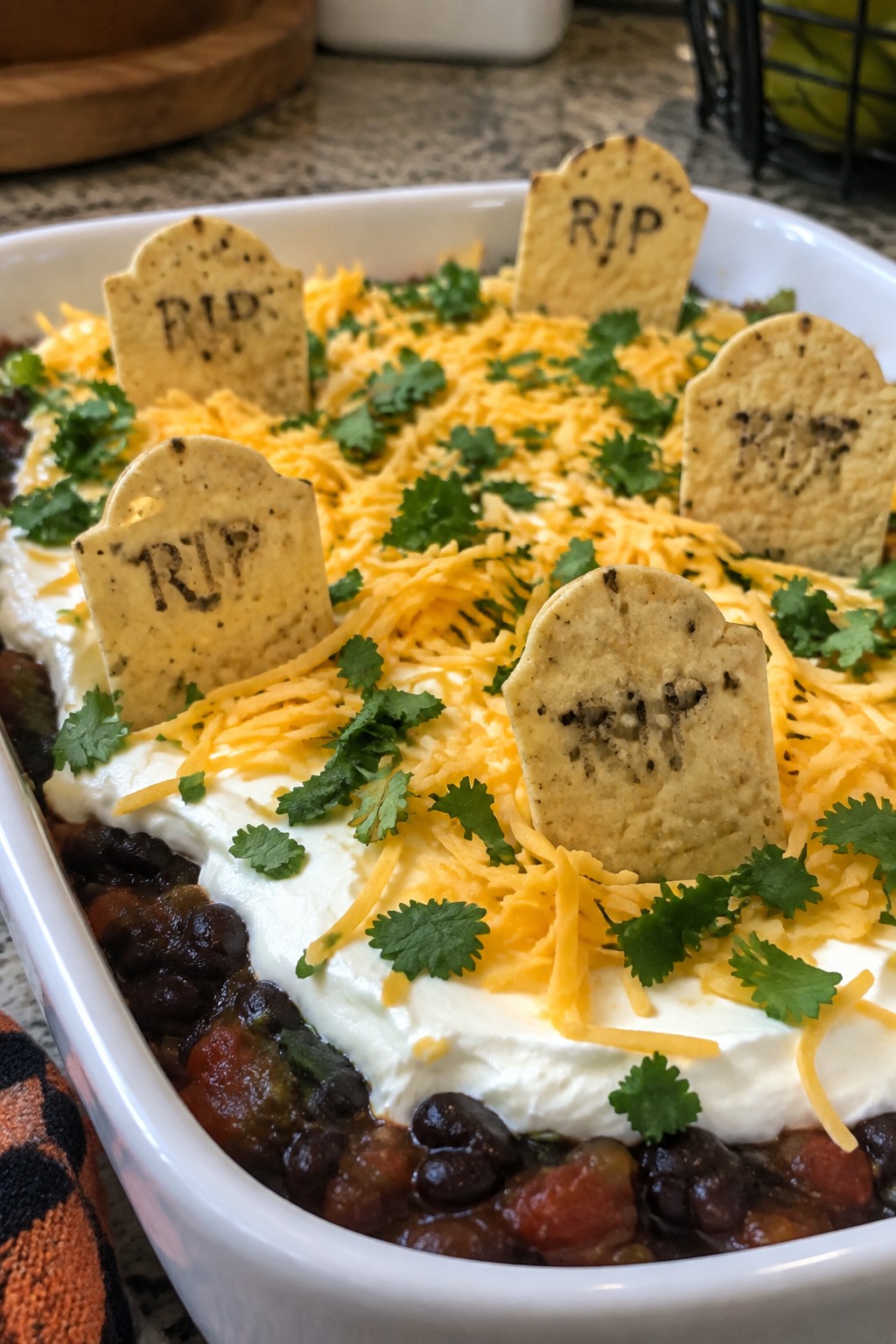 Graveyard Layered Black Bean Dip with Tombstone Chips
