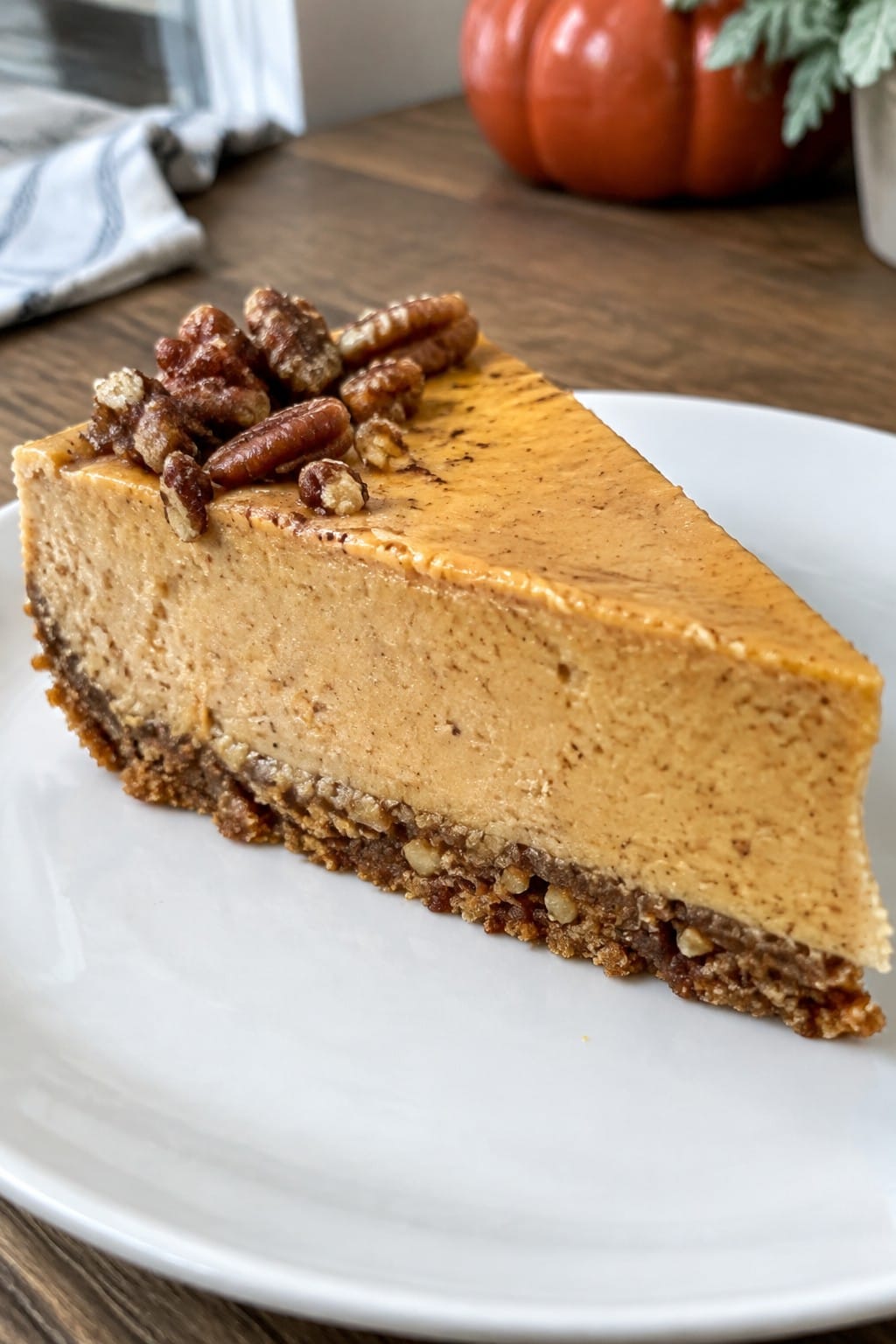 Bourbon Pumpkin Cheesecake with Candied Pecan Crust