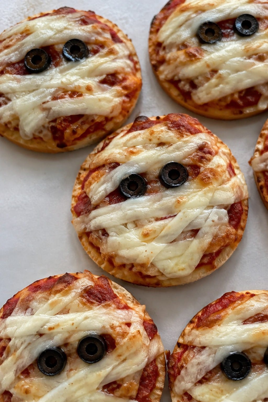 Cheesy Mummy Olive-Eye Pizzas