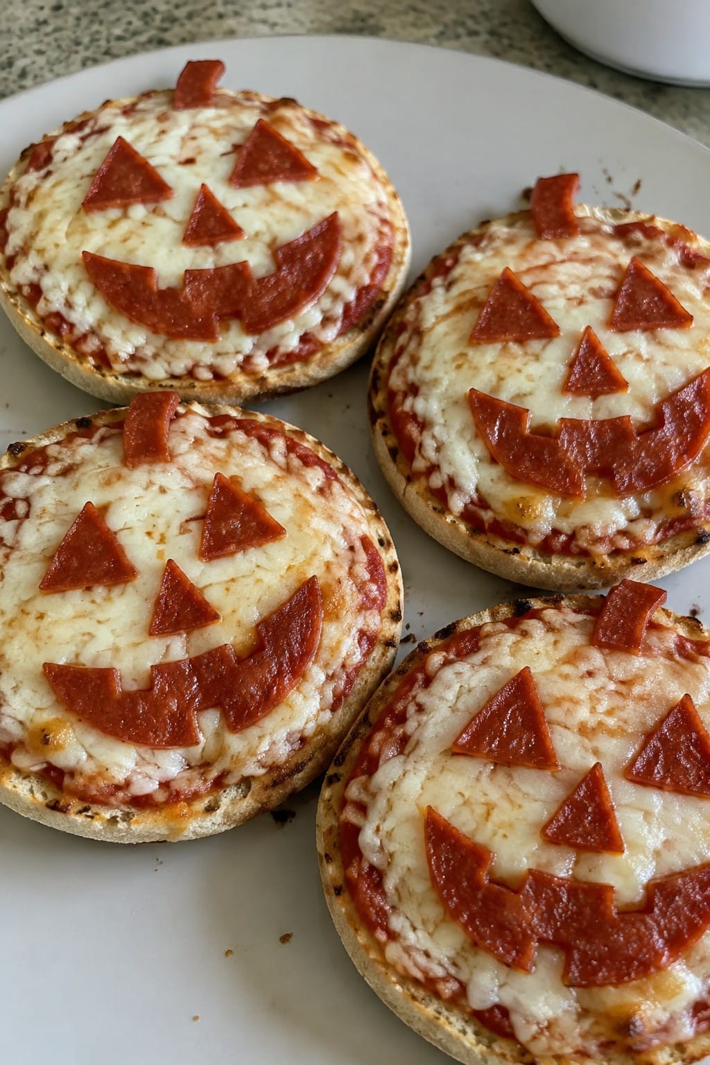 Jack-o'-Lantern Pepperoni Pizzas