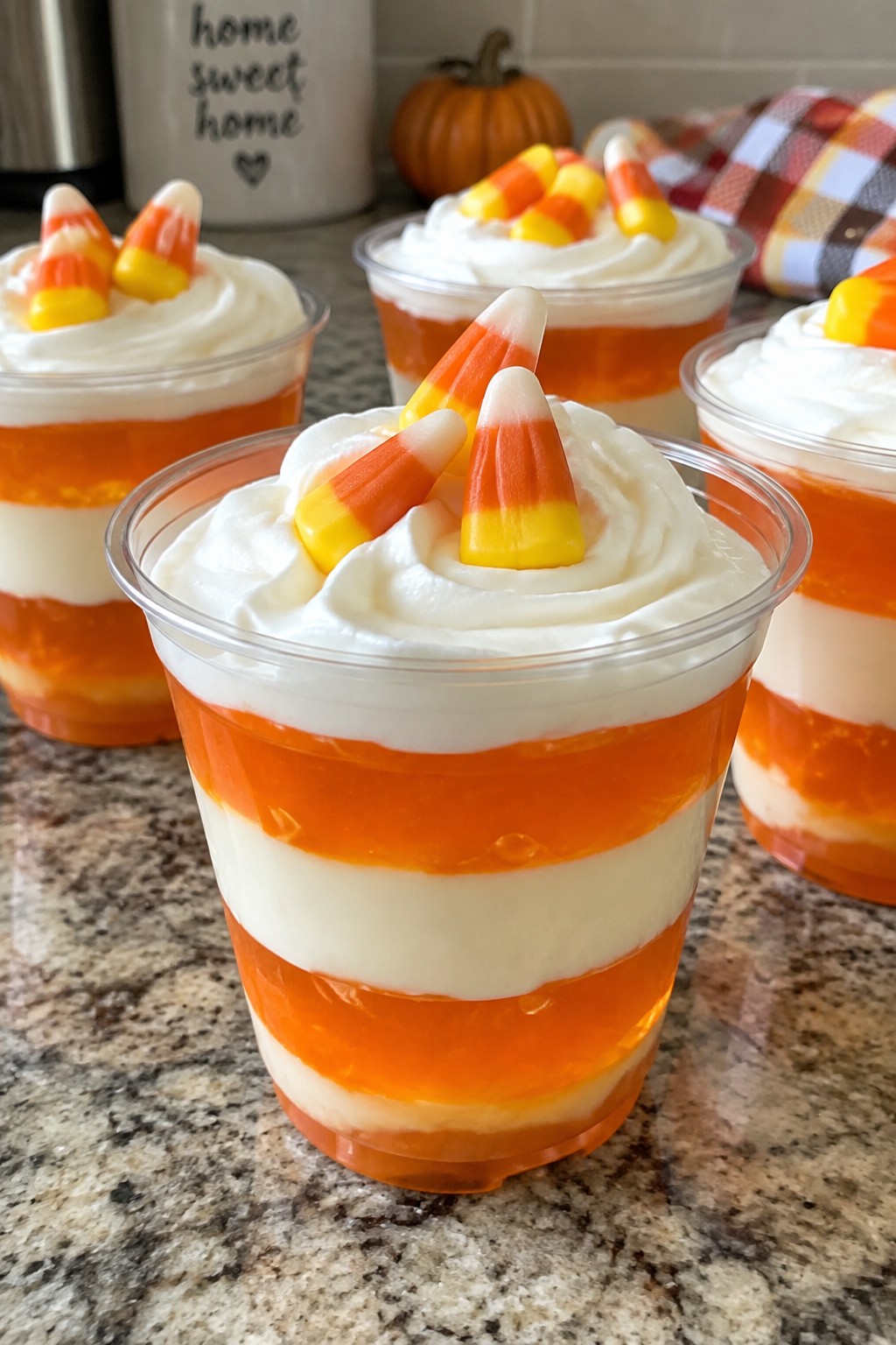 Layered Candy Corn Parfaits with Vanilla Pudding and Orange Gelatin