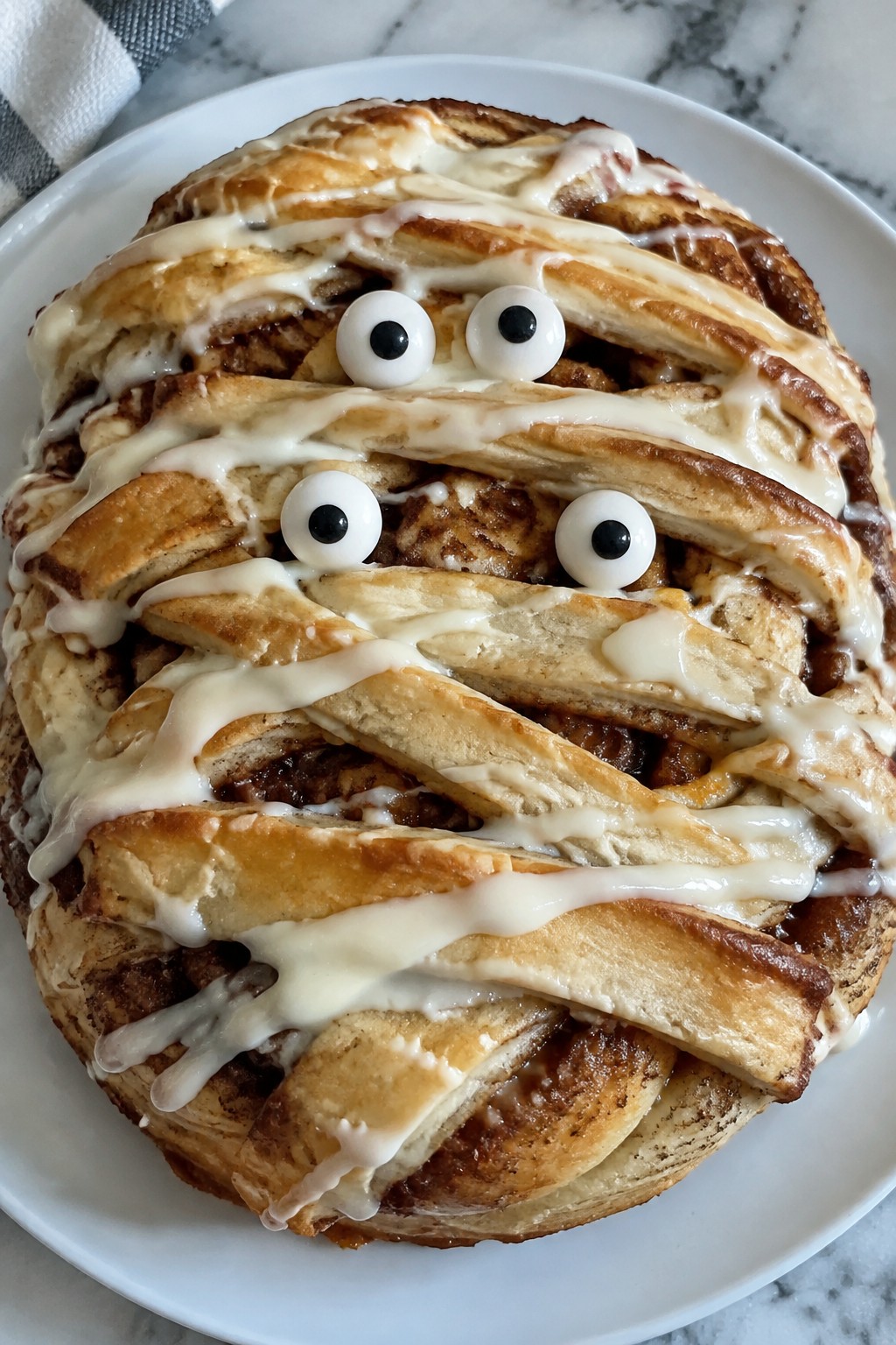 Mummy Wrapped Cinnamon Roll Cake
