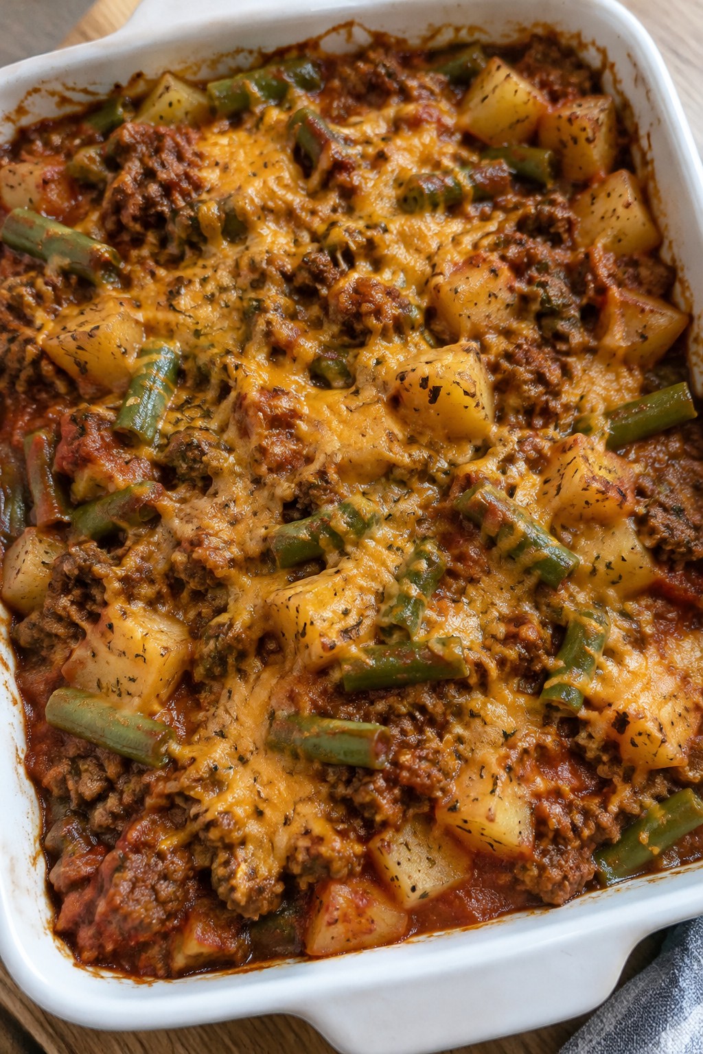 Beef, Potato, and Green Bean Casserole with Tomato Herb Sauce